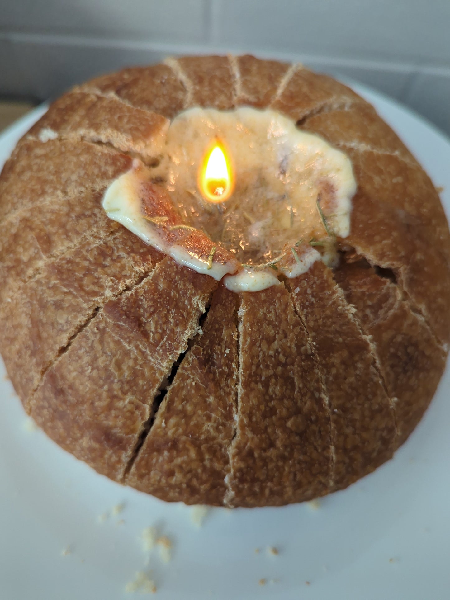 Sharing Sourdough loaf with a butter candle